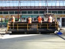 Bestratingsmachine Tiger-Stone met personeel